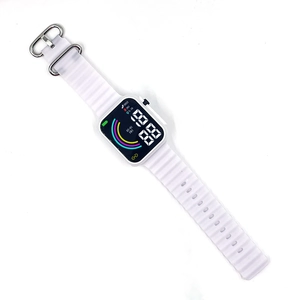 Detail of white digital LED watch with square face and textured silicone strap