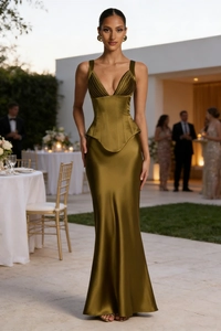 Detail of elegant olive green satin evening gown featuring a fishtail hem and corset bodice