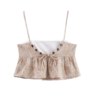 Khaki peplum tank top with white leaf print and decorative buttons on linen-like fabric