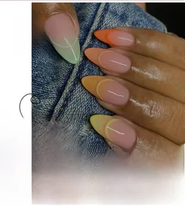 Macro shot of macaron gradient almond press-on nails with curved French tip detailing