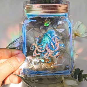 Rainbow suncatcher window sticker featuring a vibrant blue and orange octopus illustration