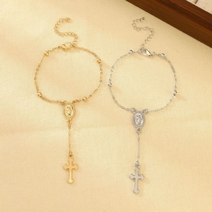 Detail of beaded cross and Virgin Mary charms on adjustable woven rope bracelets