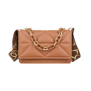 Brown quilted crossbody bag with wide logo strap and decorative resin chain accessory