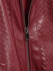 Close-up of dark red woven faux leather material and high-quality metal zipper detail