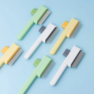Self-cleaning pet grooming brushes in pastel green, white, and yellow for dogs and cats