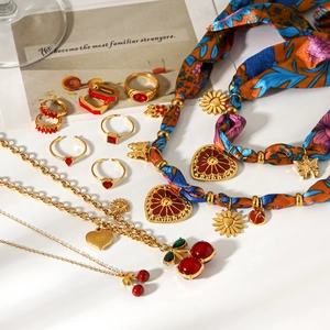 Luxury gold jewelry set featuring red zircon necklace, rings and earrings for women