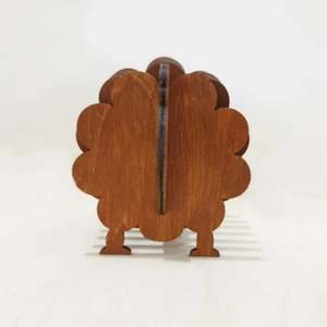 Detail of wooden sheep coaster set showing the slotted assembly and natural wood texture