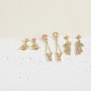 Vintage gold earrings set featuring pink zircon Saturn, bears, and star pendants