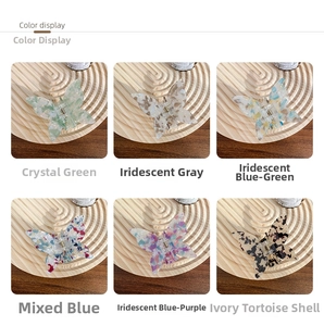 Close-up of butterfly hair clips in varied finishes like tortoise shell and watercolor