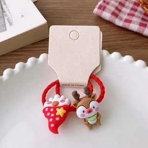 Detailed view of 2-piece Christmas hair ties featuring cute Santa and reindeer charms