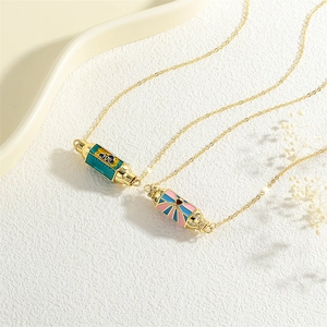 Detailed macro view of gold plated hexagonal enamel pendants with zircon devil eye patterns