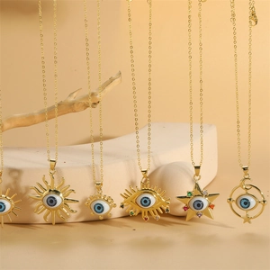 Golden evil eye pendant necklaces with sun and star motifs on elegant display