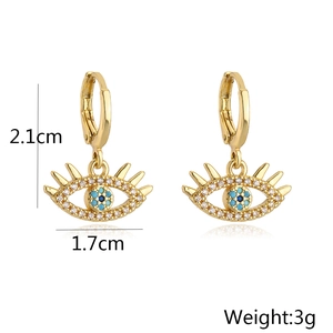 Detail showing 18K gold evil eye earrings with blue zircon and exact size measurements
