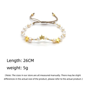 Detailed shot of handmade woven pearl bracelet with gold stars and length specifications
