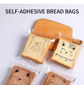Close-up of cute cartoon self-adhesive bread bags with toast on a light wood background