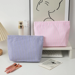 Striped seersucker travel toiletry bag with large capacity in blue and pink colors