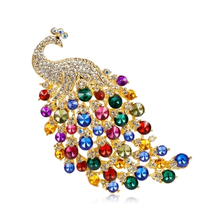 Exquisite oversized peacock brooch featuring vibrant multicolored crystals on metal base