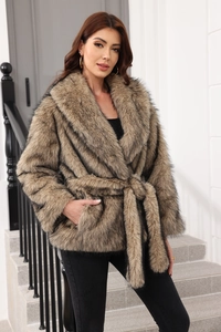 Detailed texture of brown faux fur coat with belted waist and soft notched lapels