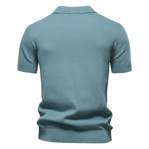 Detailed back view of a light blue knit Polo shirt showing premium diamond texture weave