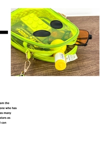 Macro view of neon green transparent PVC bag showing interior storage capacity