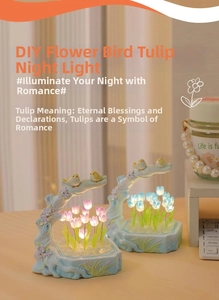Detail of DIY tulip night light featuring pink flowers and birds on a wooden base