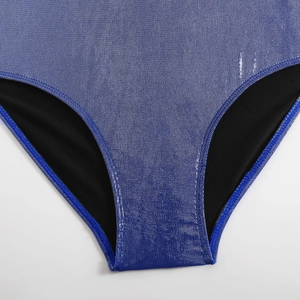 Macro detail of glossy blue metallic swimwear fabric with clean stitching and black lining