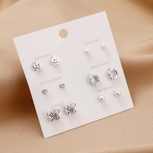 Detail of 6-pair earring set with pearls and rhinestones on a weekly organizer card