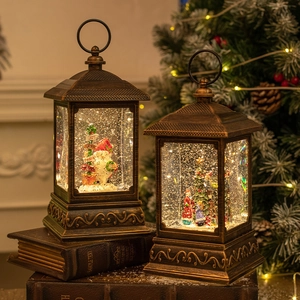 Vintage bronze Christmas lantern with LED snow globe, Santa Claus, and warm light