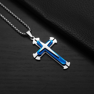 Detail of silver and blue multi-layered cross pendant with sleek steel chain