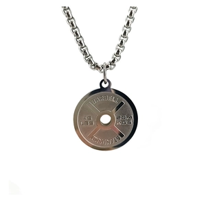 Macro shot of silver stainless steel barbell pendant with 45 LBS and 20.4 KGS engraving