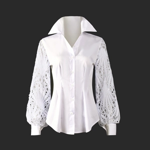 Close-up of vintage white shirt featuring intricate lace hollow out sleeves and retro collar