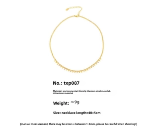 Detail of 18k gold plated stainless steel necklace with sparkling rhinestones and beads