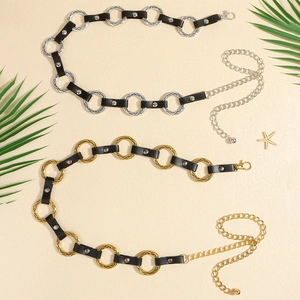 Detailed view of silver and gold punk metal waist chains with black leather accents
