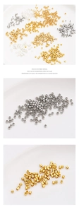 Detailed macro view of 14K gold-filled crimp beads and tubes for jewelry making