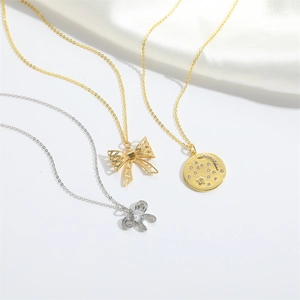 French vintage necklace set with bow pendants and engraved celestial star moon coin