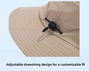 Detail of adjustable drawstring toggle on khaki quick-dry outdoor hiking bucket hat