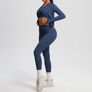 Three-piece navy blue yoga set featuring a high-waist legging and zip-up jacket