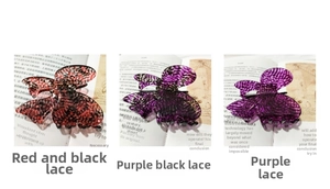 Detail view of retro lace bow hair claws in elegant red, black and purple patterns