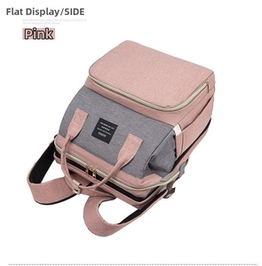 Pink and grey diaper bag with reinforced handle, large capacity and side bottle pocket
