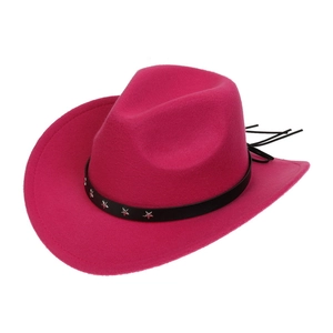 Detail of rose red western cowboy hat with black star-studded leather band and curved brim