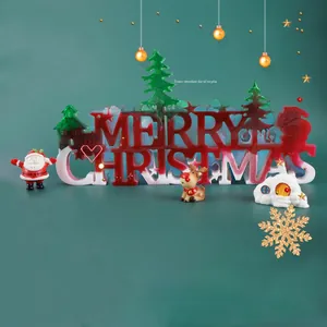 Macro detail of Merry Christmas resin mold kit with Santa, reindeer, and tree ornaments
