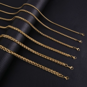 Golden titanium steel Cuban and dragon bone chains in various sizes on black leather
