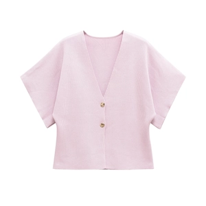 Detail of light pink ribbed knit cardigan with V-neck and gold button accents