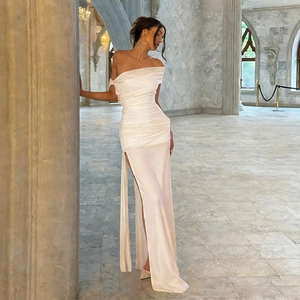 Elegant white one-shoulder satin maxi dress with side slit and pleated ruched details