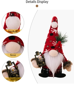 Detail display of Christmas gnome with knitted snowflake hat and a lighted kerosene lamp