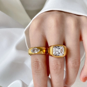 18K gold plated titanium ring set featuring emerald cut and marquise cubic zirconia