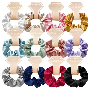 Set of 12 glossy satin scrunchies in various colors displayed on white cards