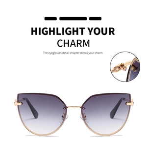 Detail of gradient purple lenses and golden metal frame on cat-eye sunglasses