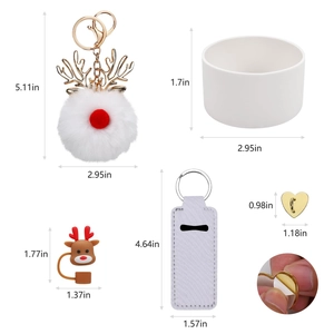 Detailed view of Christmas Stanley cup accessories with deer charm and white pom-pom