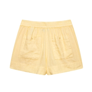 Detail view of yellow linen shorts featuring back pockets and an elastic waistband